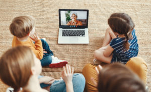 Kids in front of a computer for a zoom call