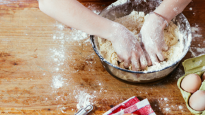 hands kneading dough